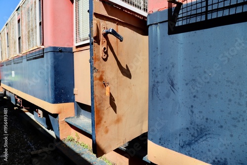 Close-Up of Train Car Door and Handrail, Train Car Side View