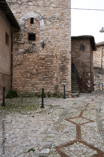 Medieval town of Narni. Umbria region, central Italy. Medieval city: a typical old street. Holidays in Italy. Ancient italian city rich in history. Italian old buildings. Cloudy day.  
