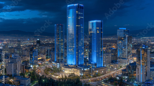 City skyscrapers illuminated at night boast architectural grandeur