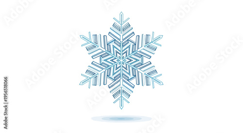 A delicate snowflake falls gently in the cold winter air outdoors