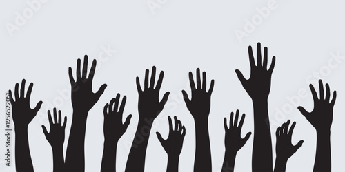 Silhouettes of many hands raised up in the air, symbolizing voting, participation, or asking questions.