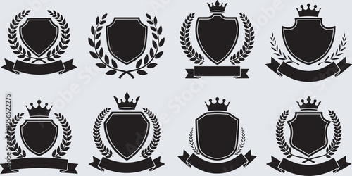 Collection of blank black shields with crowns, laurel wreaths, and banners, ideal for heraldry and emblems.