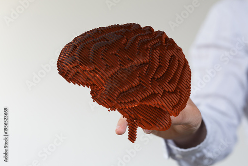 A 3D rendered brain held in...