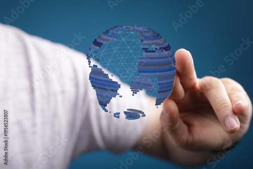 Hand holding a digital glob...