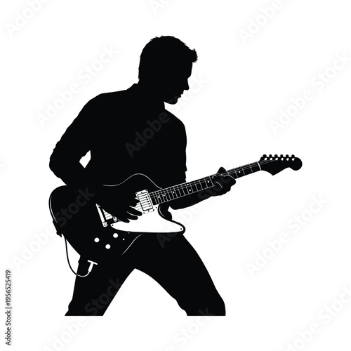 Silhouette of a musician passionately playing an electric guitar on stage, creating a dynamic scene.