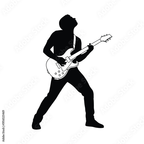 Silhouette of a musician passionately playing an electric guitar on stage, conveying energy and emotion.