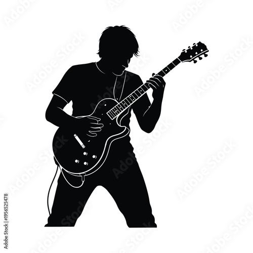 Silhouette of a musician passionately playing an electric guitar on stage, conveying energy and emotion.
