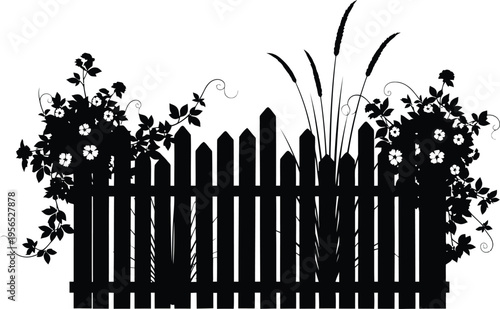 A black silhouette of a wooden fence with flowers and objects