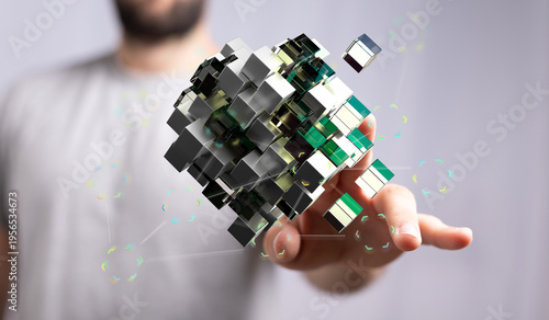 Man holding a digital 3D cu...