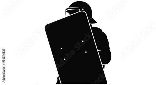 Riot police officer with shield in stark black silhouette
