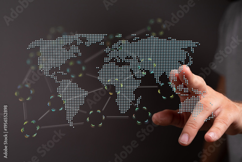 Hand touching digital world...