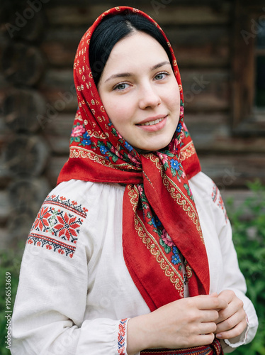 Portrait of a young beautiful woman with a scarf on her head