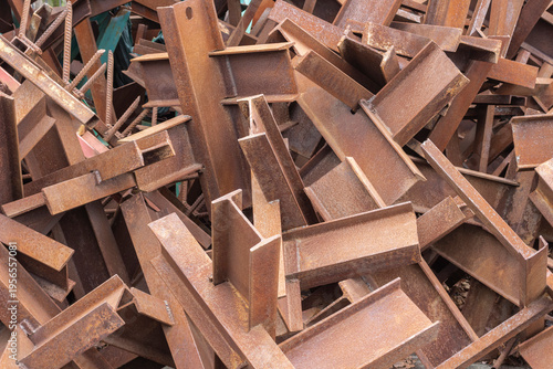 A pile of rusty metal beams. Close-up.