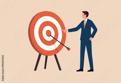 Specific goal, clarify objective or target, focus or concentrate on purpose to win business mission, perfection or aiming at target concept, businessman pointing at center of bullseye archery target