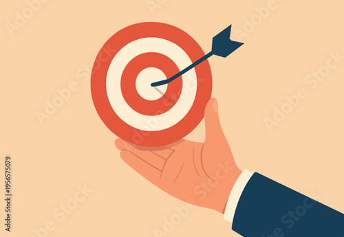 Goal or target, focus and concentration to achieve success, purpose or objective, aiming at target bullseye, accuracy, challenge and aspiration, businessman hand hold target with arrow hit bullseye