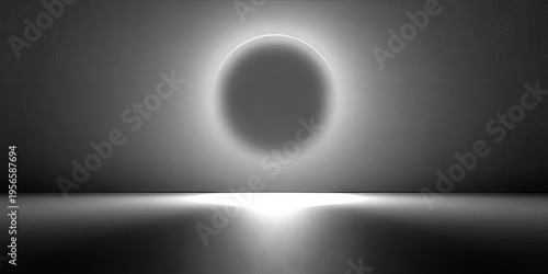 Abstract grayscale scene with glowing circular halo above reflective water surface on dark gradient background, suited for branding, tech, meditation, and editorial mood imagery