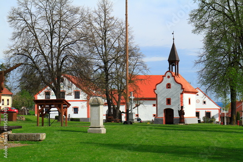 Historic Holasovice Village street with beautifully preserved South Bohemian Folk Baroque farmhouses