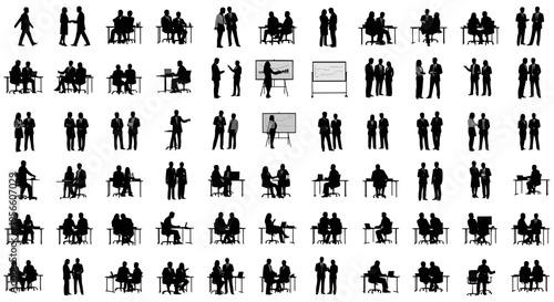 People are standing and sitting in an office setting with furniture