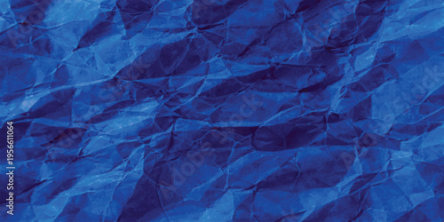 Abstract blue background with crumpled paper texture and a dark blue paint design featuring a pink silk textile pattern on a grunge material surface