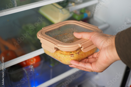Cuadro en lienzo Food storage in a kitchen fridge at home in the evening