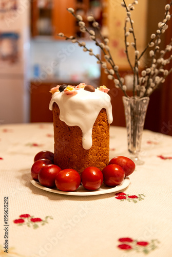 Easter cake with eggs on a plate is on the table