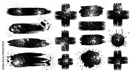 Collection of black ink brush strokes and splatters.