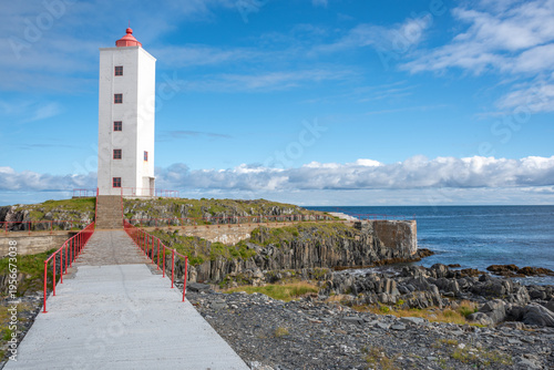 Kjølnes Lighthouse with Red Railing Pathway Leading Lines in Summer Blue Sky, Berlevåg, Finnmark, Norway
