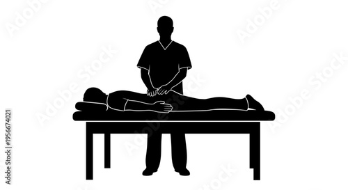 Massage therapist performing massage on a client lying on a table in a spa