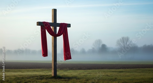 Wooden cross draped with red cloth
