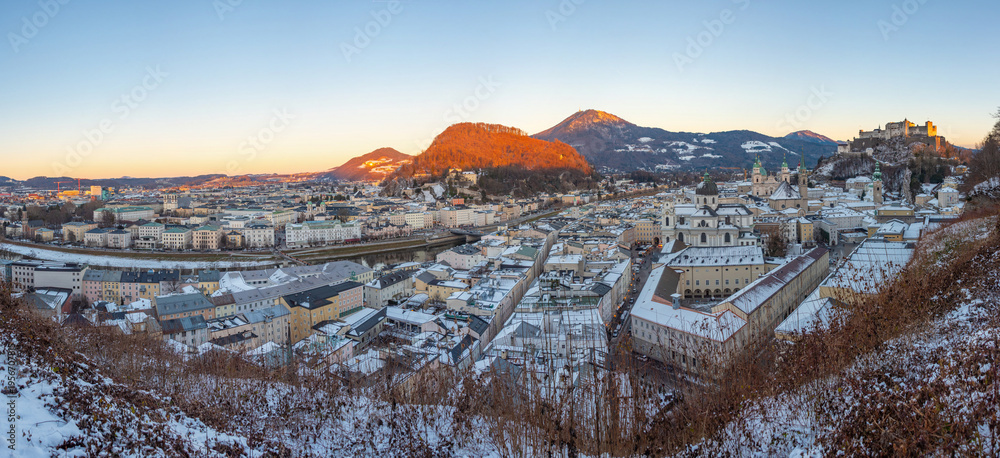Fototapeta premium Sunset view of Hohensalzburg fortress overlooking the old town o
