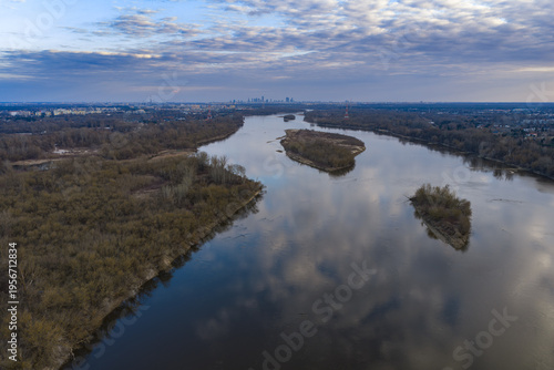 Aerial view of the Vistula River and Warsaw skyline at dusk