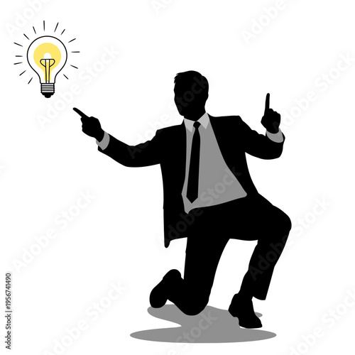 Businessman points excitedly at a glowing light bulb idea in air.