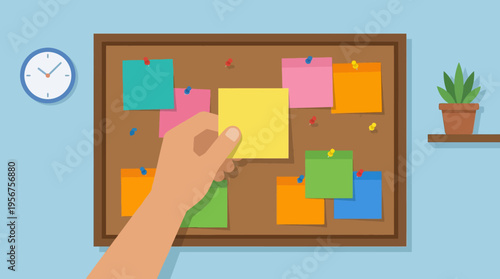 Hand placing sticky note on board.
