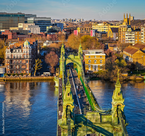 Hammersmith Bridge Over River Thames with London Skyline in Golden Light