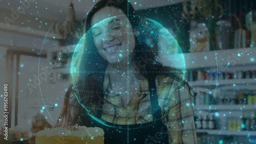 Vertical video: Teal globe forming and covering baker placing cake and macarons in bakery for promo