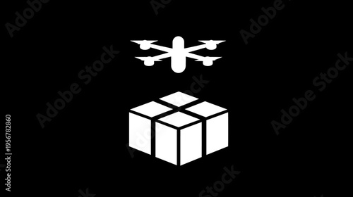 A white drone flying above a white cuboid with four equally sized squares on top, on black