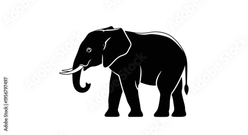 Majestic black elephant silhouette illustration with tusks and trunk, side view, graphic design element for wildlife themes