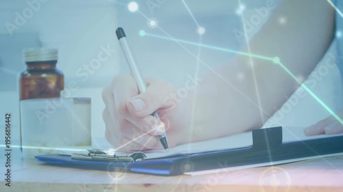 Clinician hand making first stroke on clipboard, causing network overlay revealing meds for chart