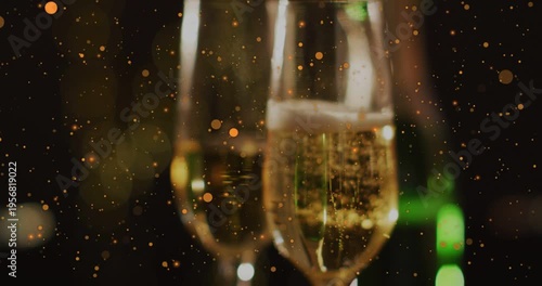 Vertical video: Champagne flutes framing, focus pulling, bubbles rising, sparks drifting for event