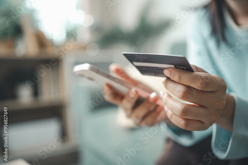 Bild auf Leinwand Customer using smartphone and credit card for buy now pay later online payment