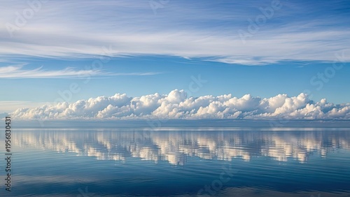 A serene ocean landscape with calm water and a blue sky