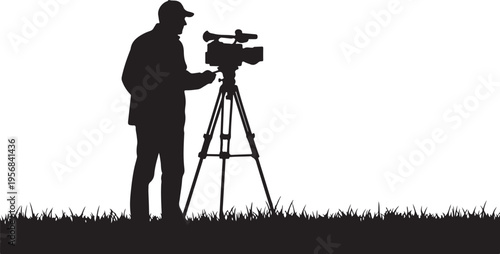 Silhouette of a cameraman filming outdoors with a tripod