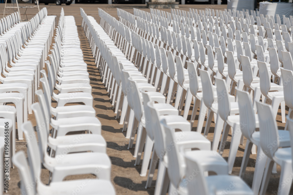 Fototapeta premium Large scale seating setup with many chairs prepared for an audience in a big event or conference environment.