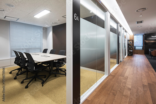 Small glass enclosed conference room in contemporary office