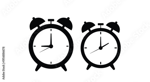 Two black alarm clocks with differing sizes and slightly varied times