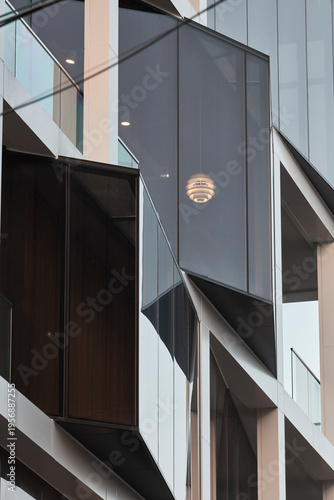 Dark contemporary facade and entry detail with angular geometry