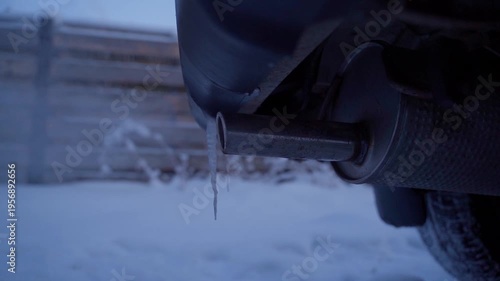Wallpaper Mural Car muffler warming up in winter with snow and icicles background close-up Torontodigital.ca