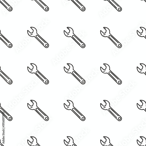 Repeating pattern of black line art wrenches on a white background