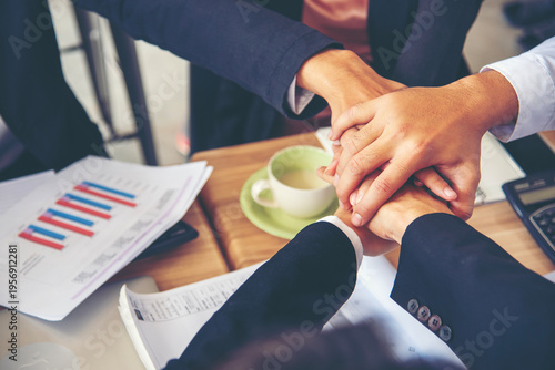 Business Hands stack together team teamwork partner corporation. Financial Planner hand holding teams partnership growing economy. Personal financial planner. Office firm team investment advice plan
