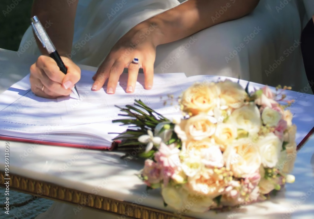 Obraz premium wedding documents being signed with flowers